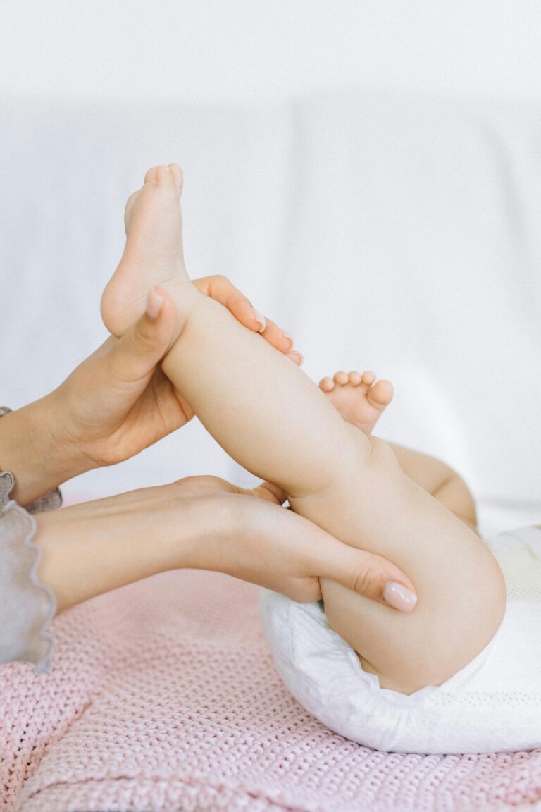 Close-up of baby massage on legs showing safe and gentle technique.